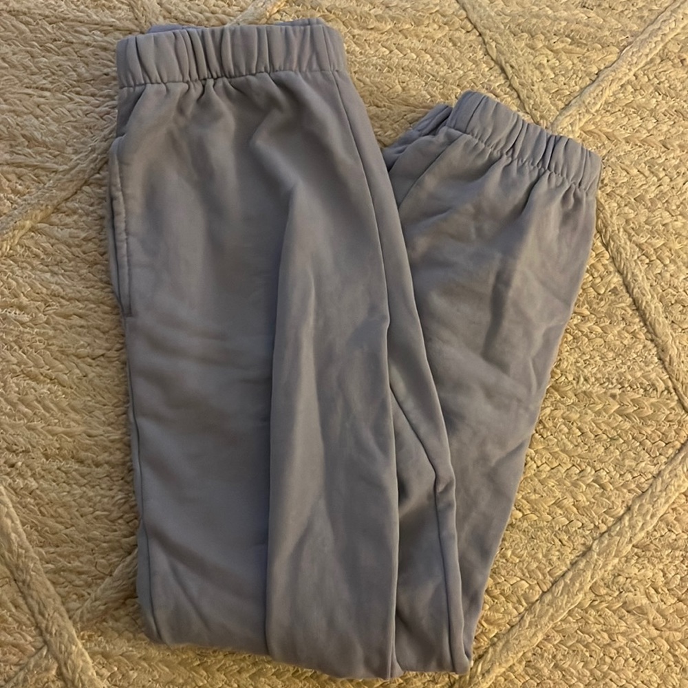 gently used (doesn’t come with tags) purple-gray sweatpants